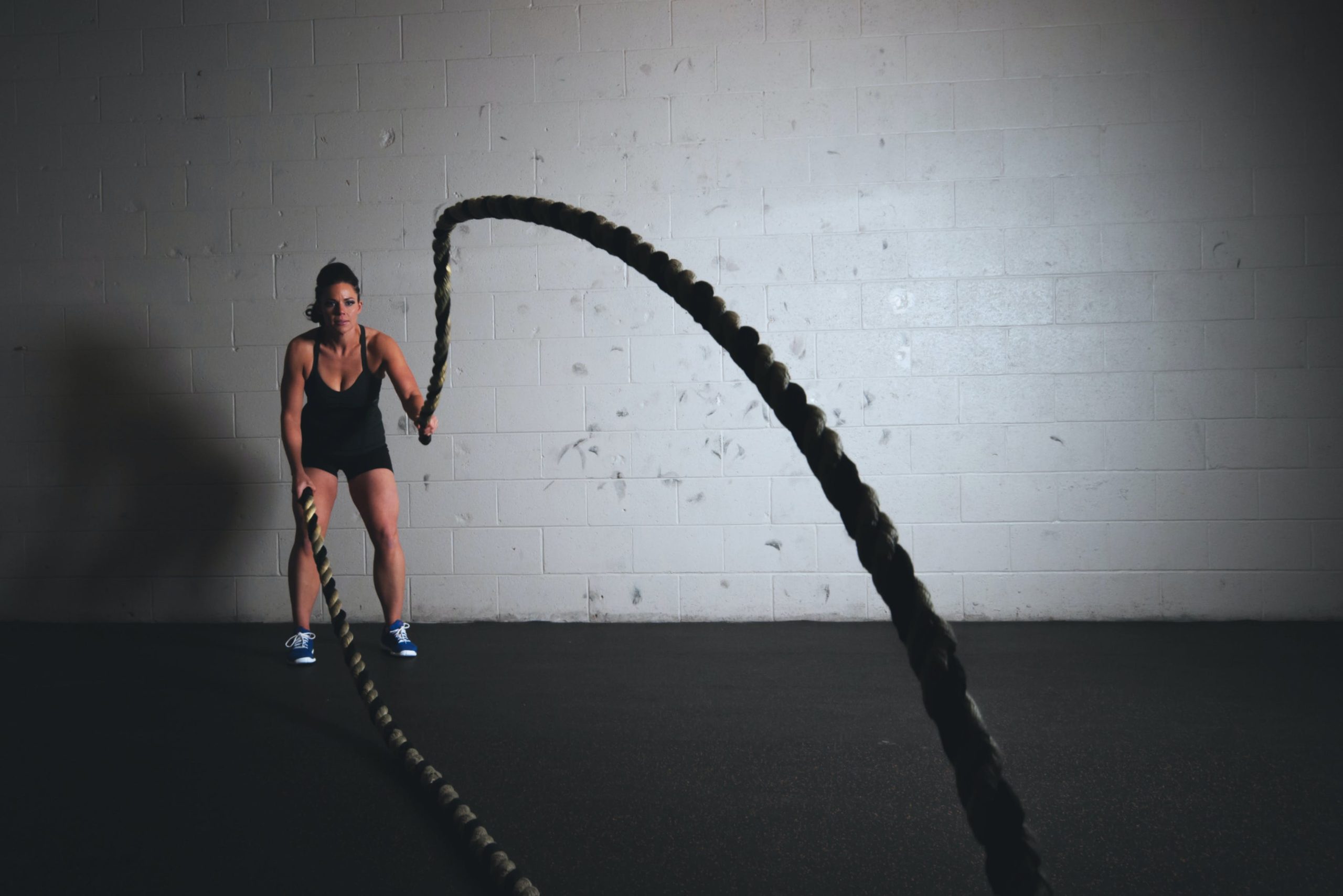 Personal Trainer exercising with a weighted rope